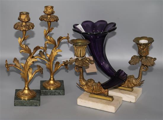 An Amethyst glass cornucopia candle stick and another (a.f.) and a pair of French gilt metal candlesticks